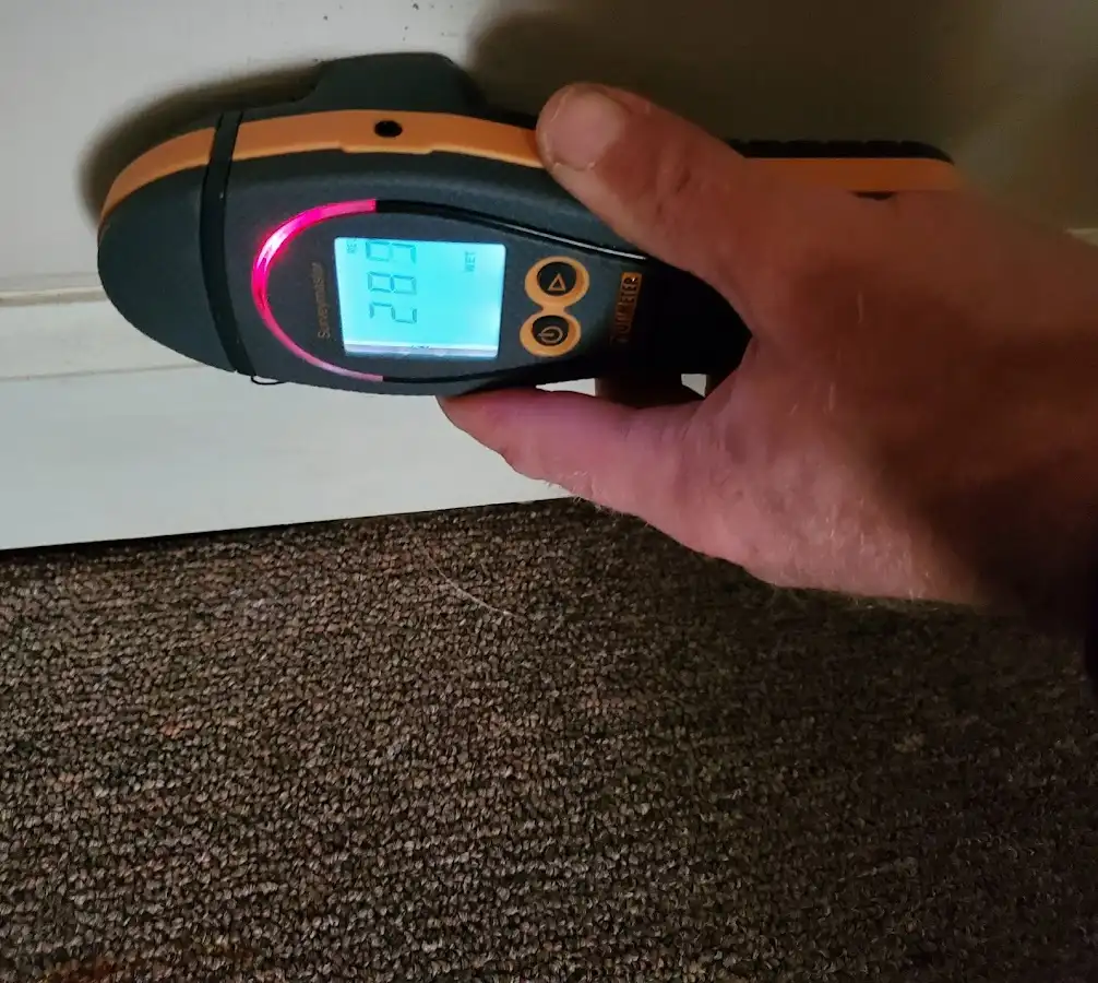 Moisture detection at baseboard during Storm Damage Restoration in Plainville